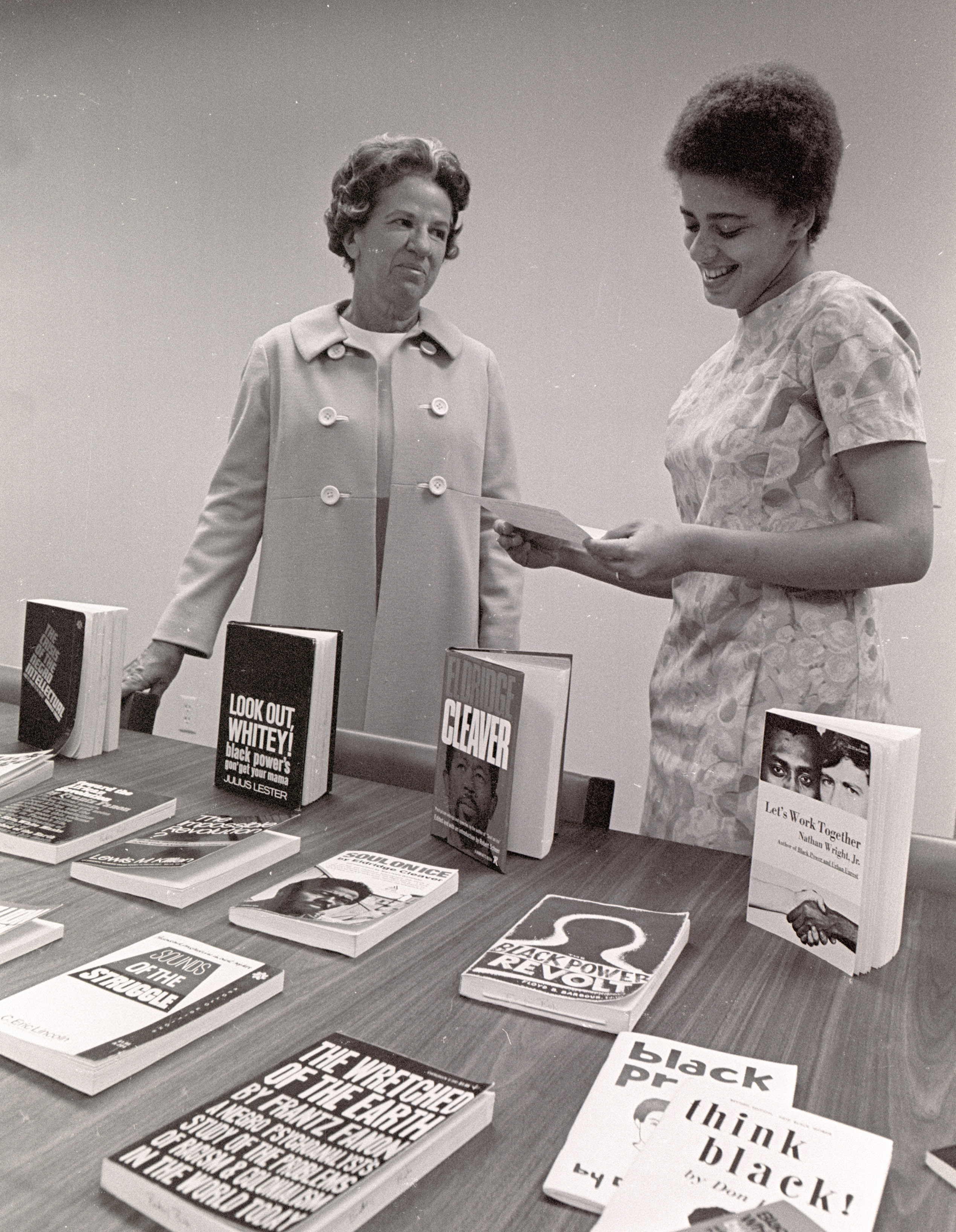 Elizabeth Snyder viewing a collection, 1968. University Archives photos.