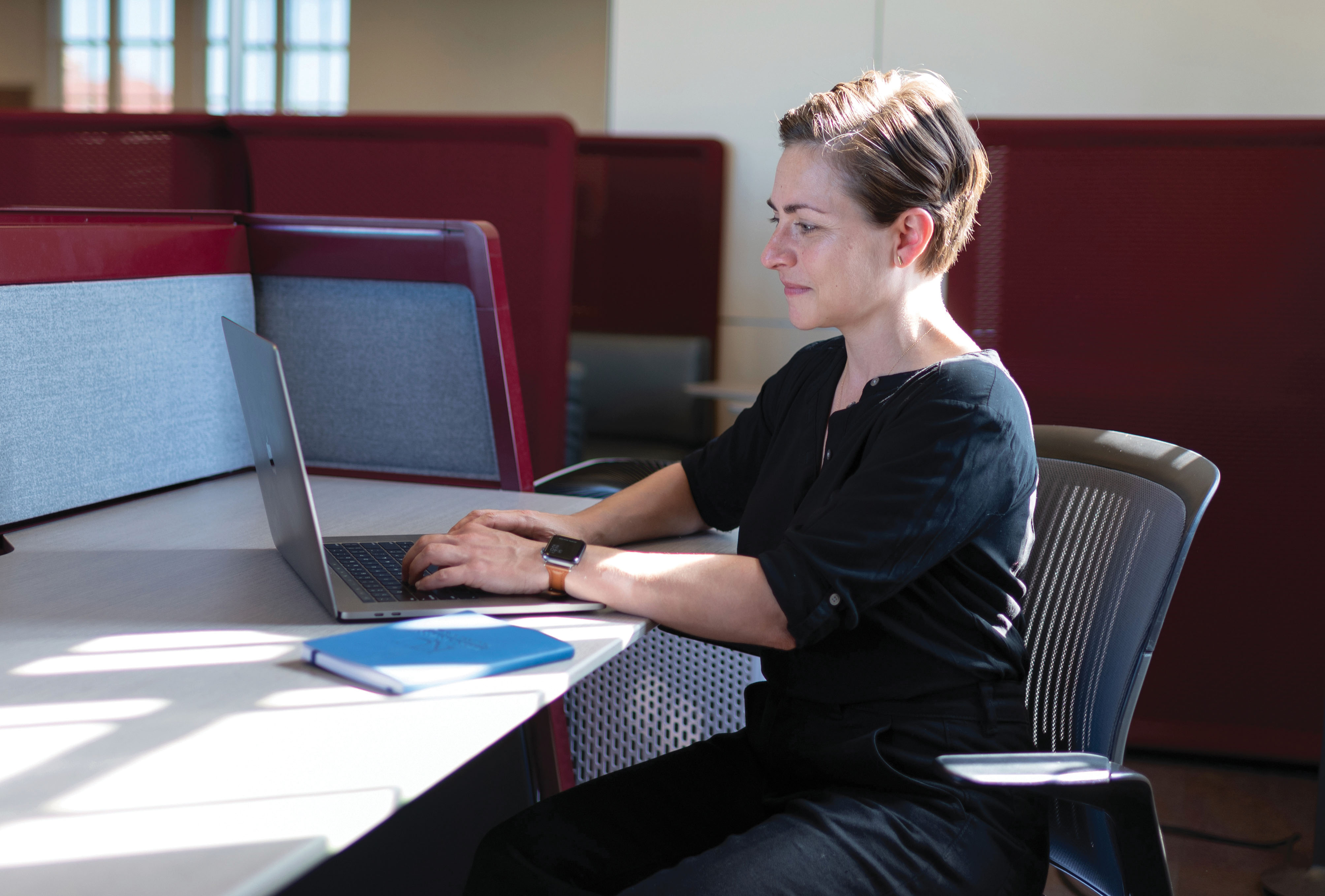 "Aimee Wilson working on a computer"