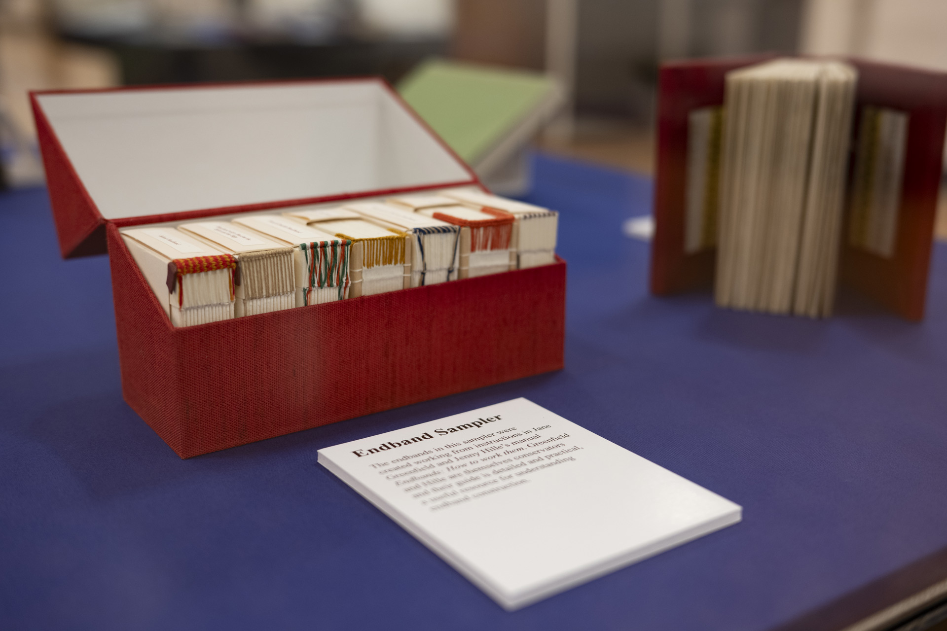 Bookbinding examples inside a display case. 
